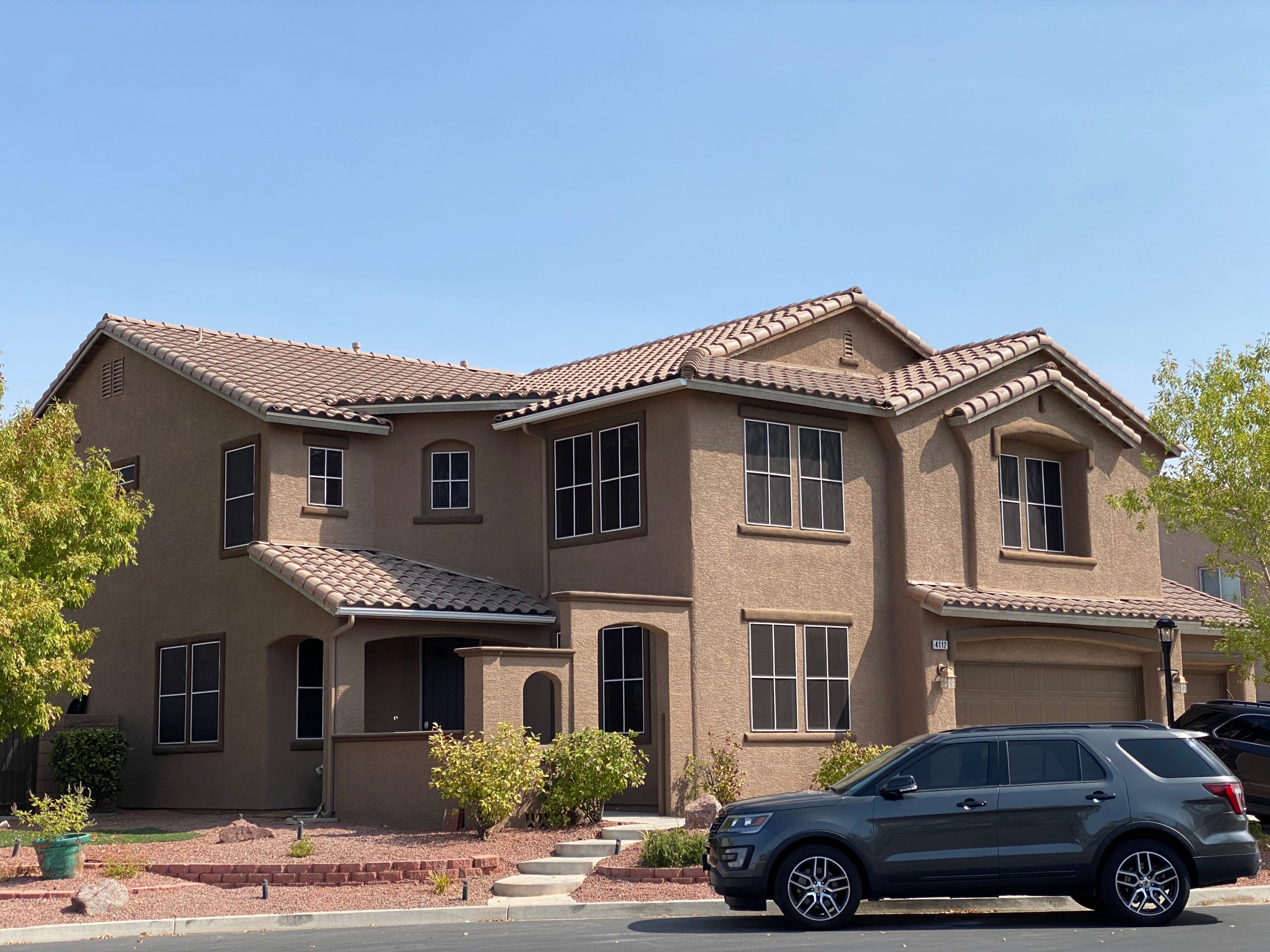 Custom solar screens installed on a Summerlin home blocking heat and UV rays before they reach the glass