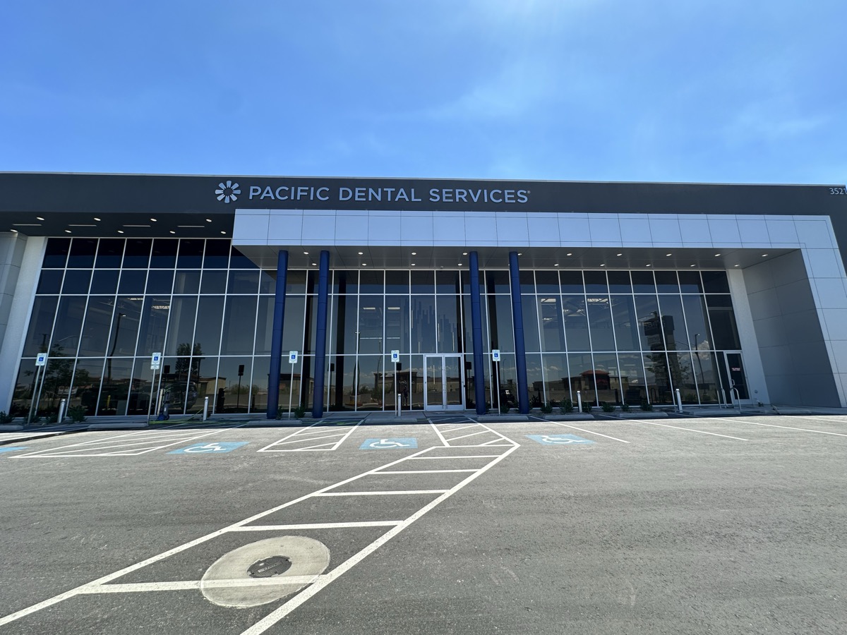 Pacific Dental Services building with sparkling clean glass facade in Las Vegas