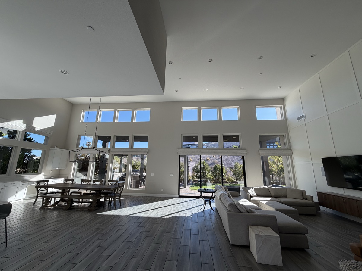 Crystal clear floor-to-ceiling windows flooding a luxury Las Vegas home with natural light after professional cleaning