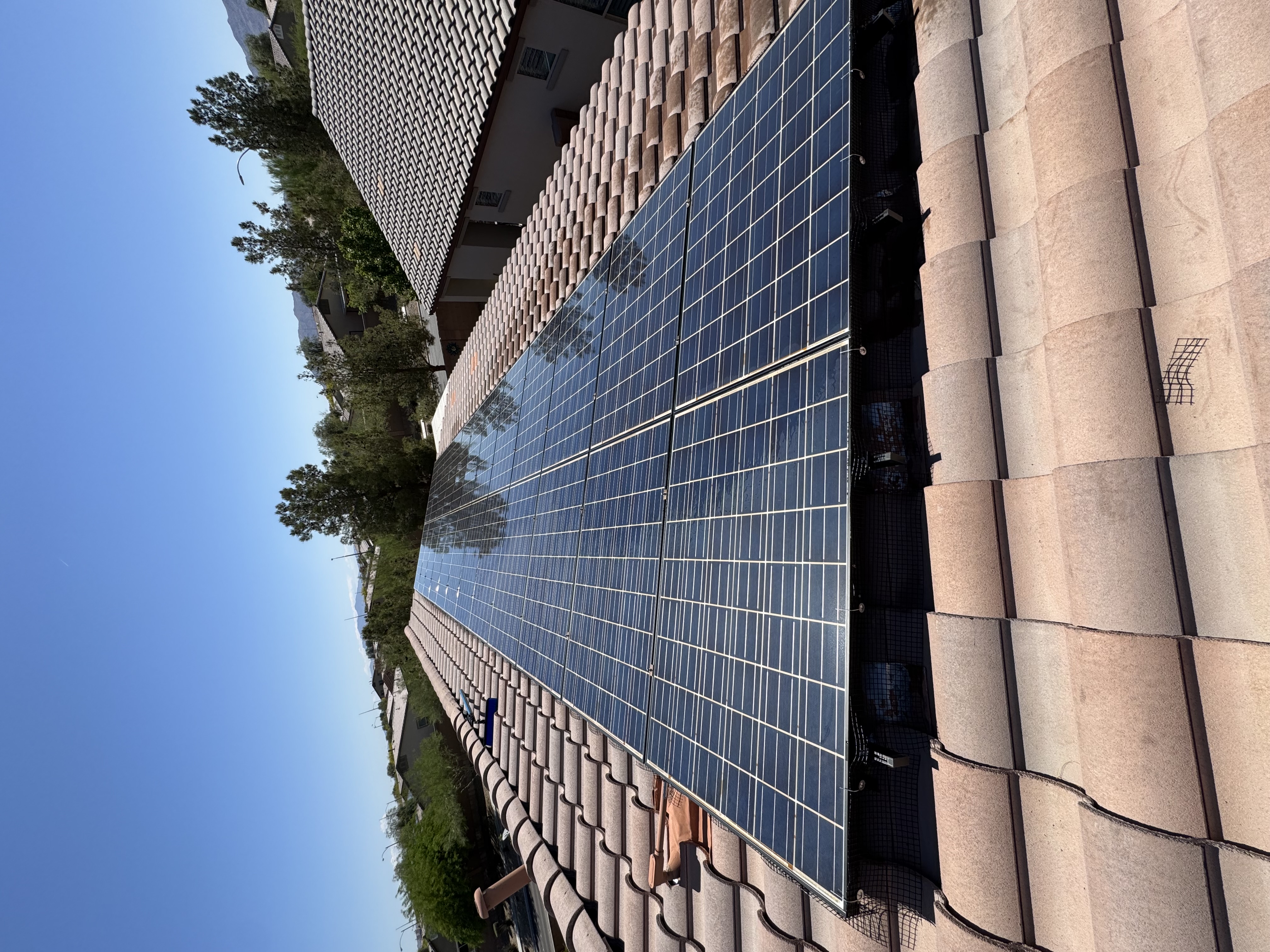 Solar panel cleaning in progress on a residential rooftop in North Las Vegas