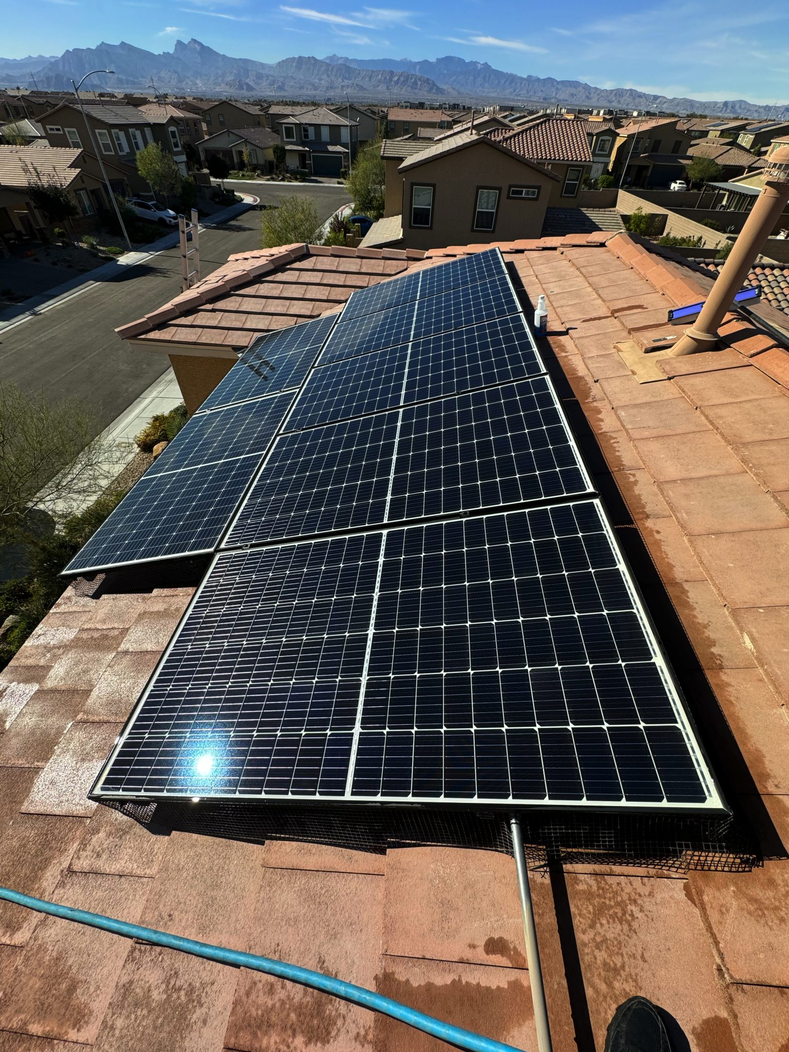 Solar panel array on a Centennial Hills Las Vegas rooftop being cleaned